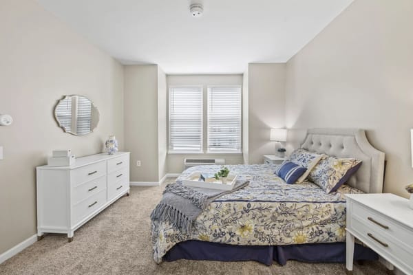 Brightly decorated resident room with floral bedding