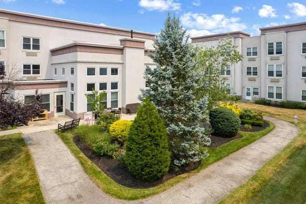 Well-maintained gardens and building exterior