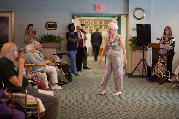 Residents enjoying a performance in a common area