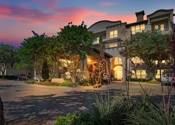 Exterior view of The Langdon at Lake Highlands with vibrant sunset.