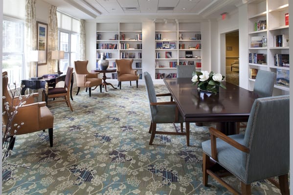 Bright common area with seating and bookshelves