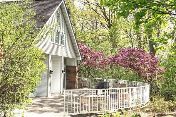 Outdoor seating area with blooming trees