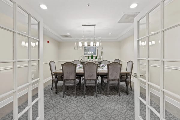 Elegant dining room with a large table and plush chairs