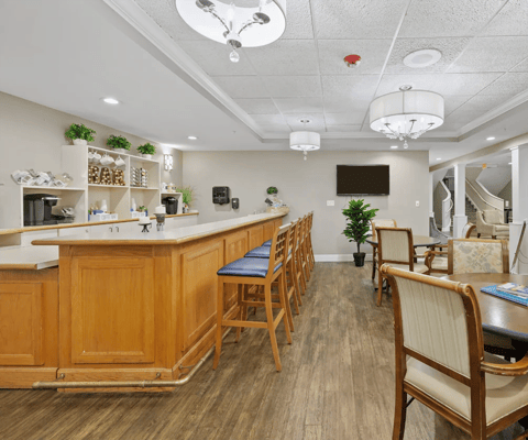 Cozy lounge area with bar seating and comfortable chairs.