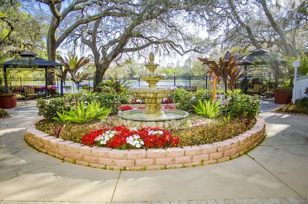 Beautiful outdoor garden with fountain and flowers