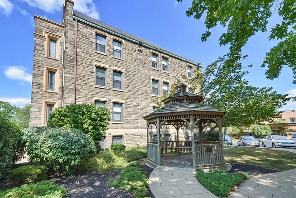 Exterior view of a nursing home with a gazebo