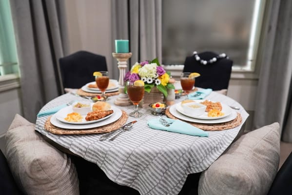 Beautiful dining table set with meals and decorations