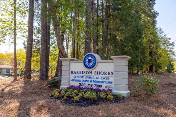 Sign for Harbison Shores surrounded by trees