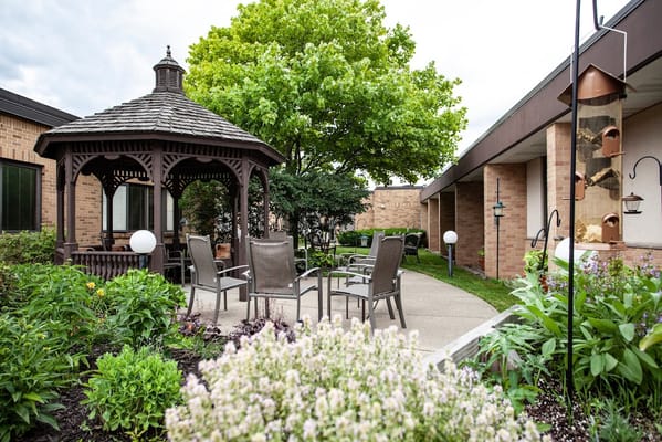 Outdoor gazebo area in a serene garden setting