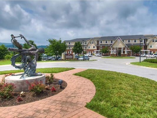 Sculpture with figures in the courtyard of TerraBella Pheasant Ridge.