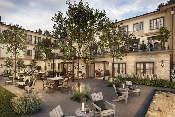 Outdoor courtyard of a senior living facility with seating areas