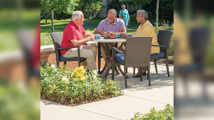 Residents enjoying refreshments in an outdoor space