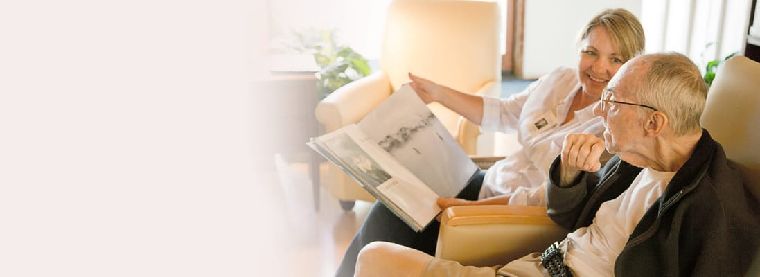 Staff engaging with a resident in a comfortable setting