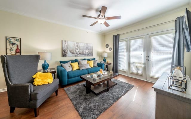 Bright and cozy common area with seating and decor