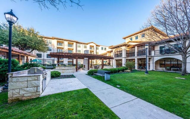 Outdoor view of a senior living facility with a landscaped courtyard