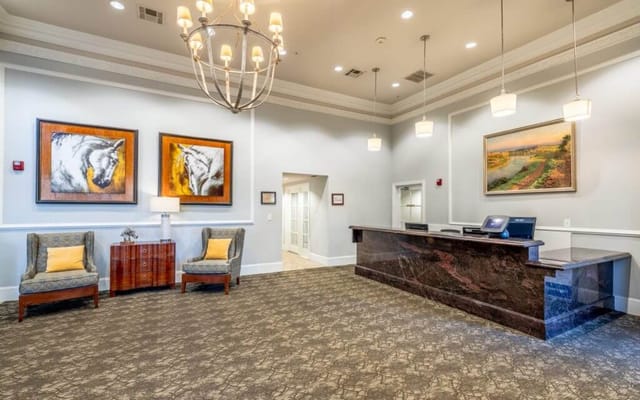 Bright lobby area with seating and reception desk
