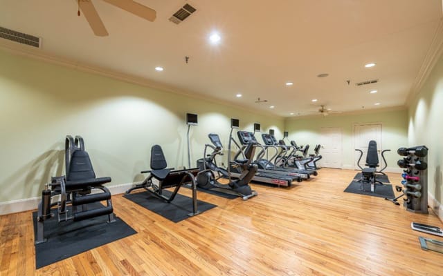 Bright fitness room with exercise equipment