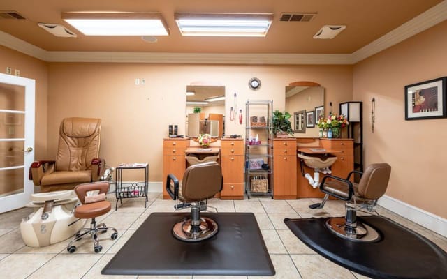 Interior view of a beauty salon area with styling chairs
