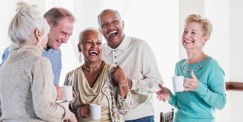 Residents enjoying a lively conversation in a common area
