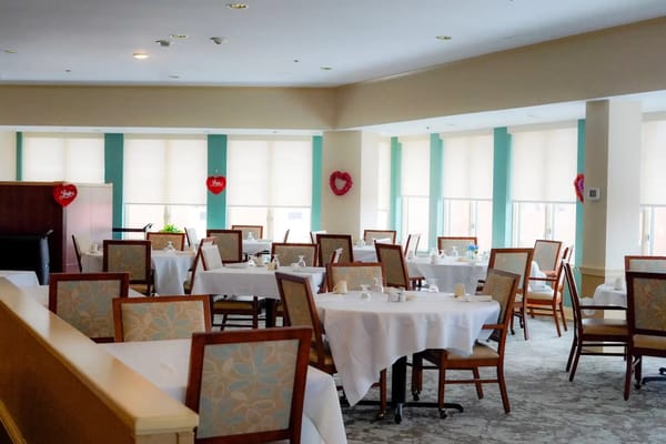 Dining room with table settings and chairs