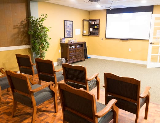 Interior activity room with chairs arranged in a circle