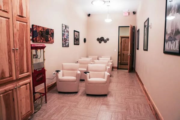 Brightly lit activity room with comfortable chairs