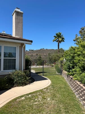 Entrance gate leading to landscaped grounds
