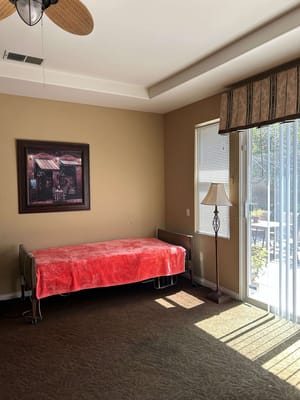 Bright private room with a bed and natural light