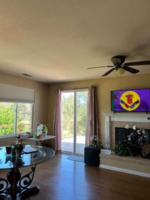 Bright interior view of a common area with a TV