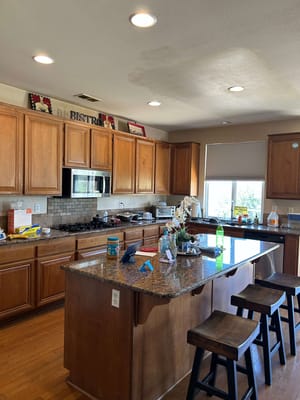 Interior kitchen with wooden cabinets and island