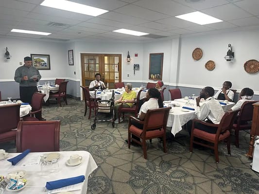 Residents enjoying a meal in the dining room
