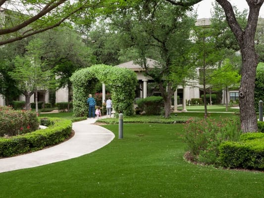 Residents walking through a landscaped garden path