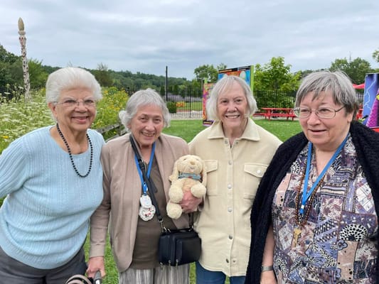 Residents enjoying time outdoors in a beautiful garden setting