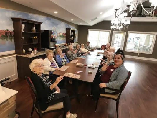 Residents participating in a bingo game in the activity room