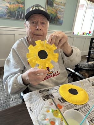 Resident creating art in an activity room