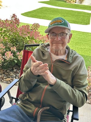 Elderly man enjoying the outdoors with a hat