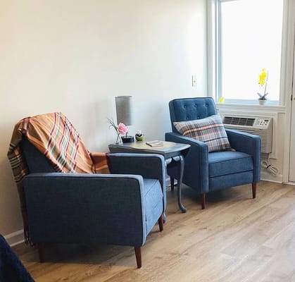 Cozy seating area with two chairs and a side table