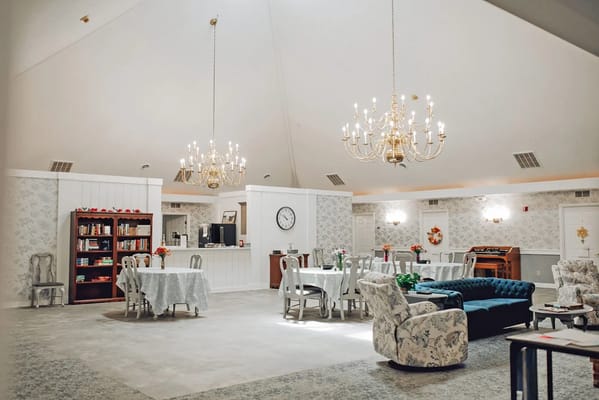 Bright common area with seating and bookshelves