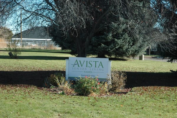 Sign for Avista Senior Living Nampa in a landscaped area