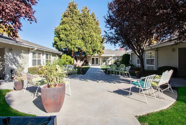 Outdoor courtyard with seating and landscaping