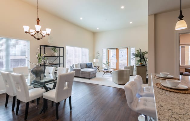 Bright common area with seating and dining table