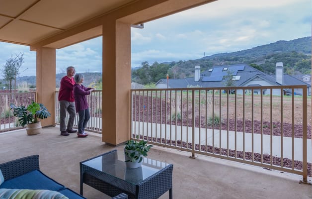 Couple enjoying the view from a balcony