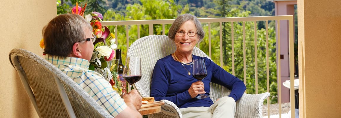Residents enjoying wine on a balcony