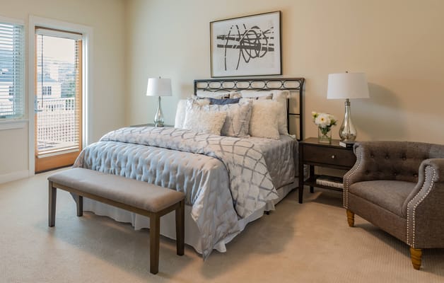 Cozy private resident room with a bed and chair