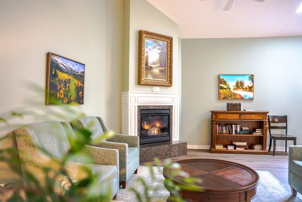 Bright common area with comfortable seating and artwork