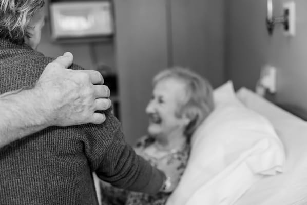 Two individuals interacting in a residential room