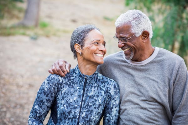 Smiling couple enjoying each other's company outdoors