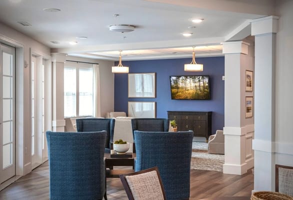 Interior view of a common area with seating and television