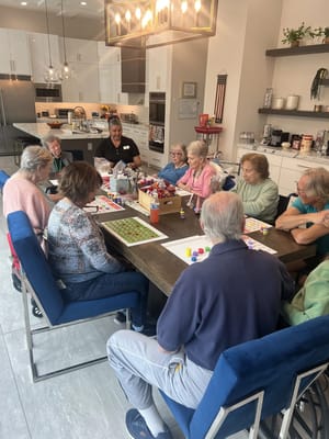 Residents engaging in a bingo activity in a common area