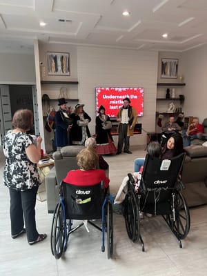 Residents enjoying a performance in a common area
